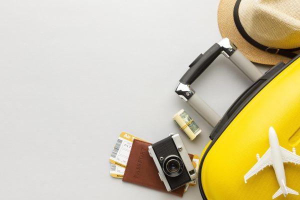 flat-lay-yellow-luggage-with-copy-space